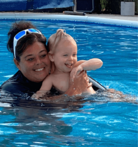 Pool Safety Solutions Owner Brooke teaching a child survival swim