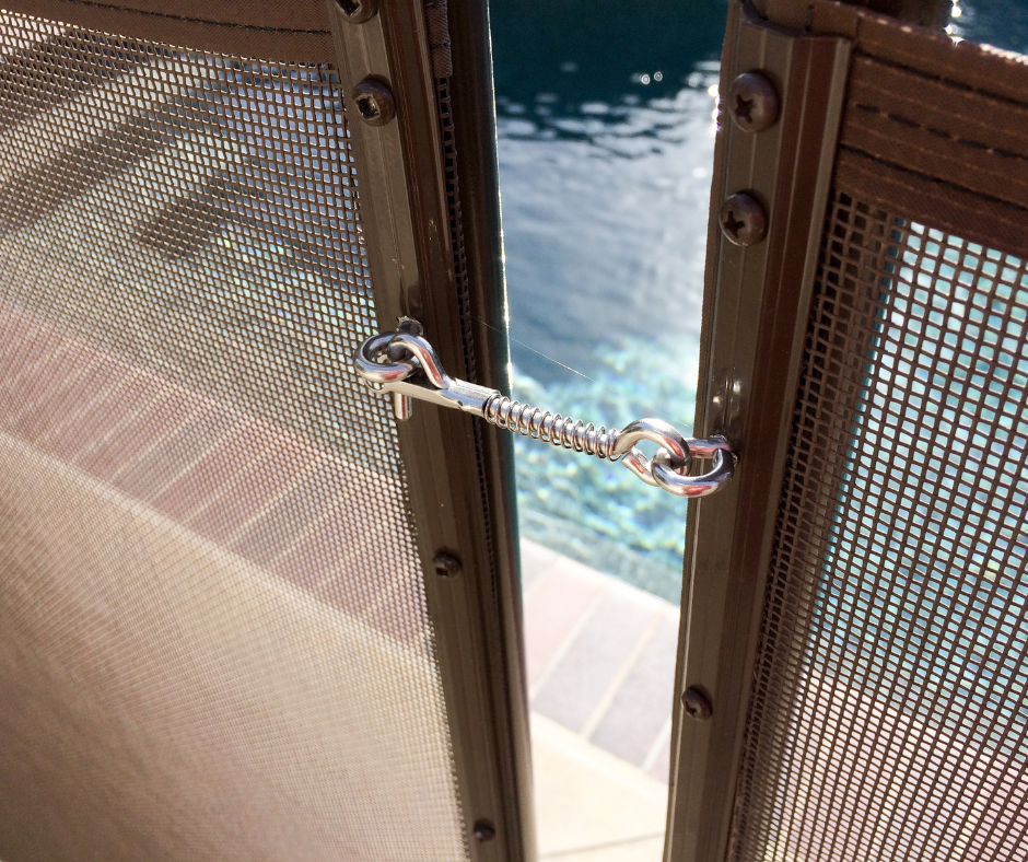 Locked Pool Fence around the pool safety fence by Pool Safety Solutions. 