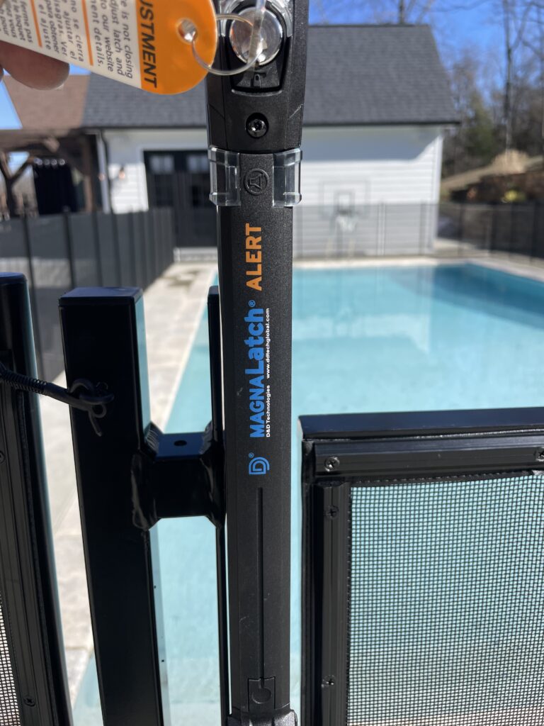 pool safety gate alarm installed on removable pool fence