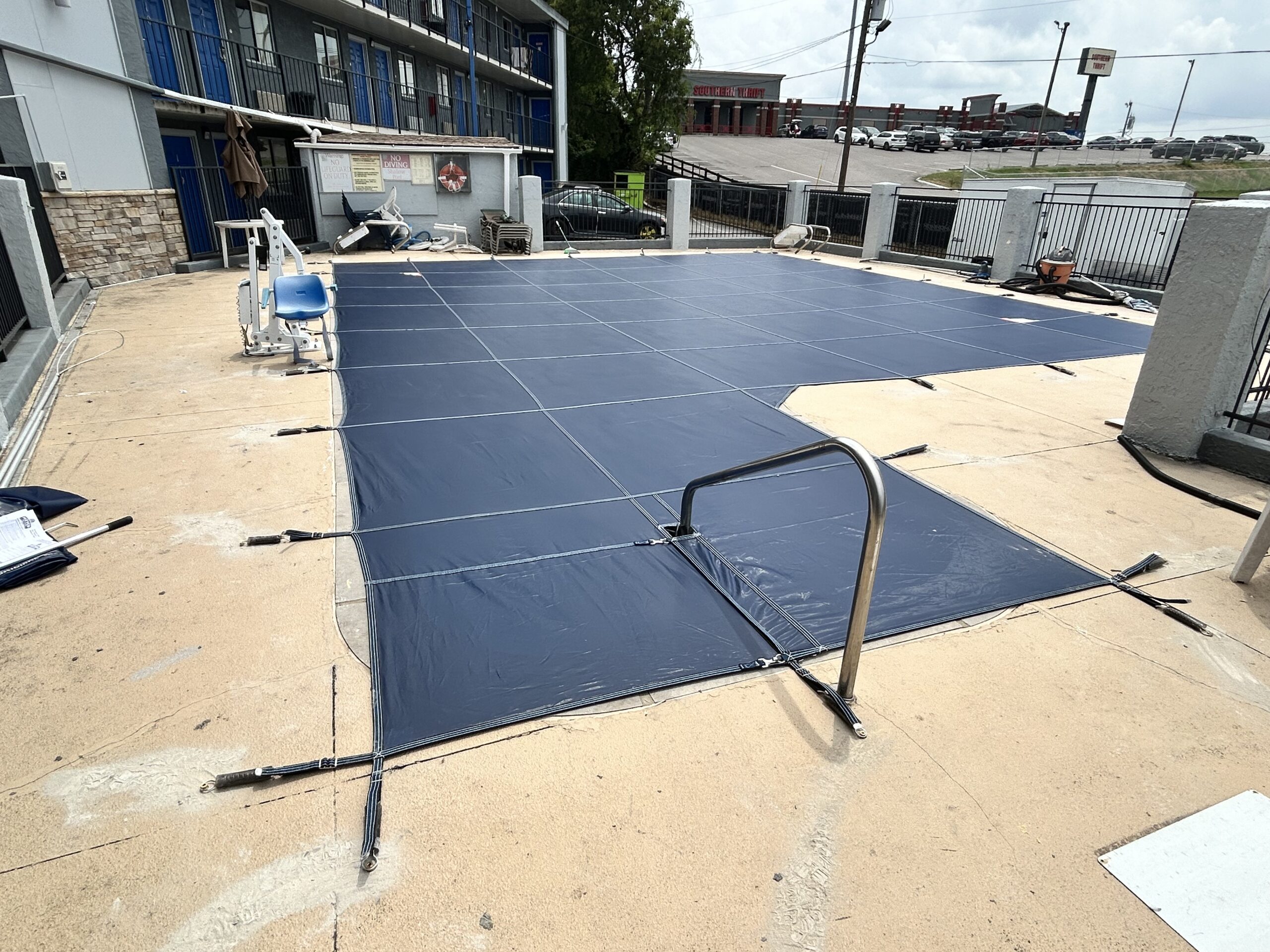 “Pool safety fencing and custom pool cover installation”