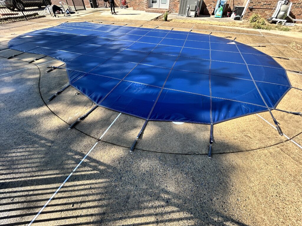 "Custom pool safety fence and cover installed in a backyard in Lebanon, Tennessee